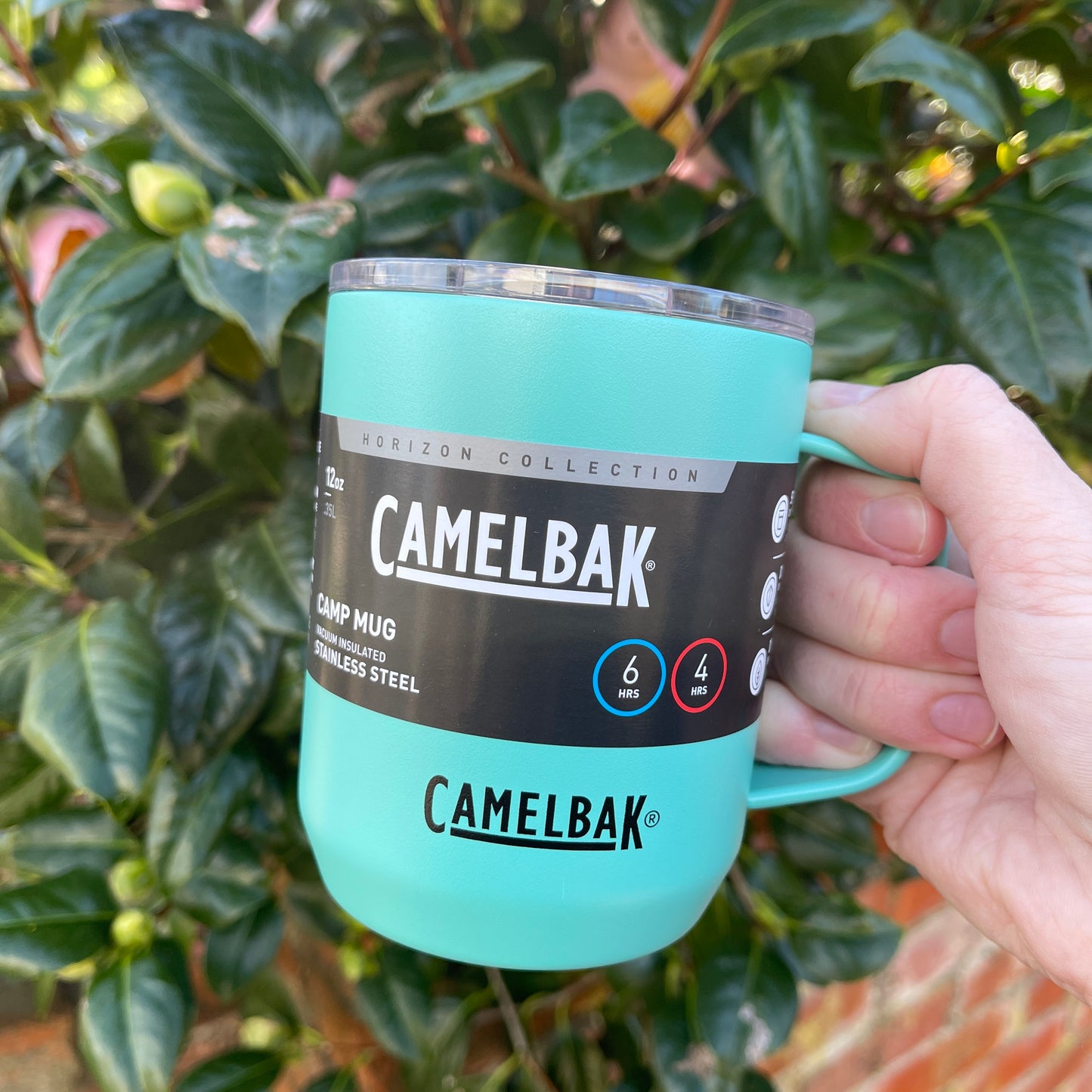 Camelbak Coastal blue stainless camping mug with lid and handle.