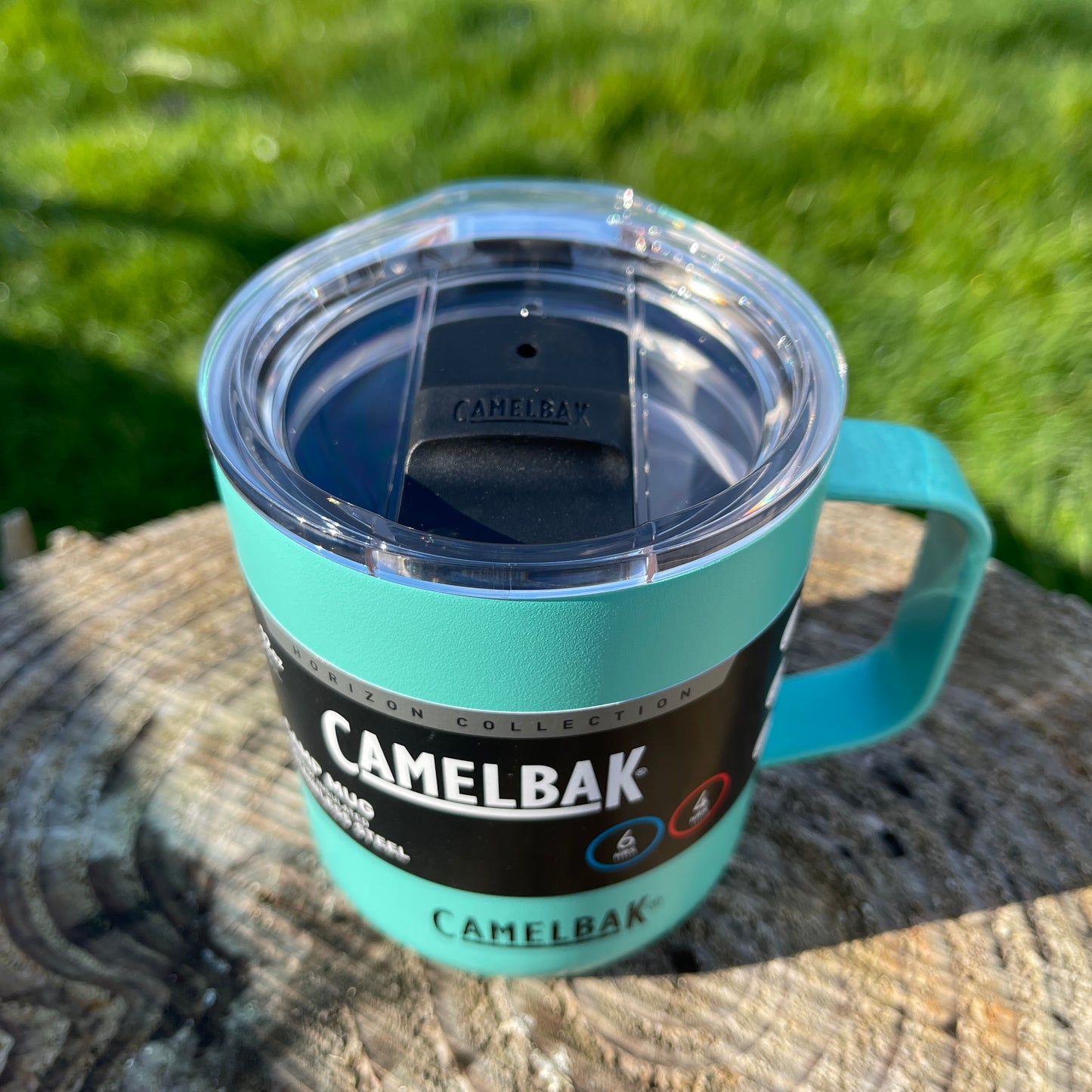Camelbak Coastal blue stainless camping mug with lid and handle.