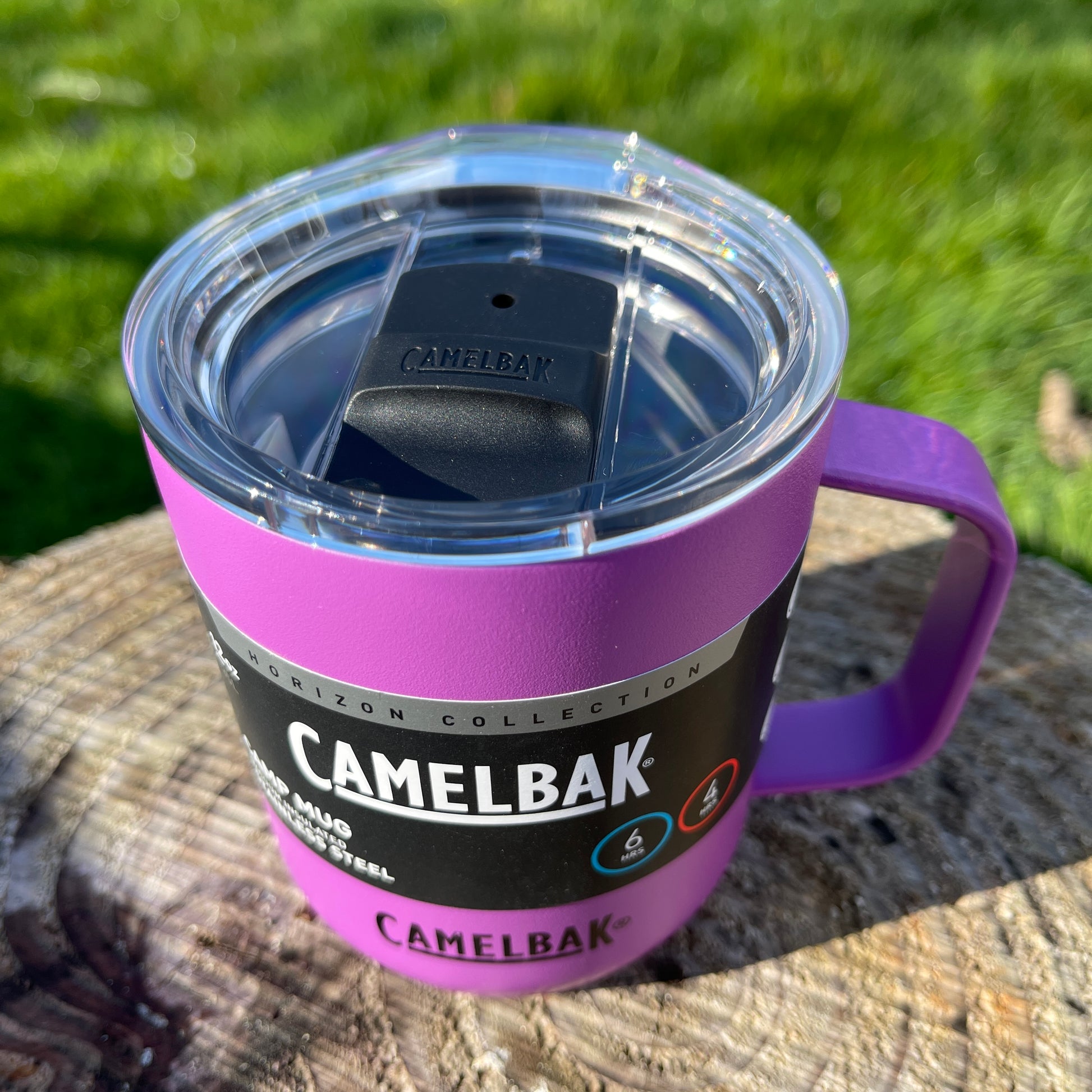 Camelbak magenta pink stainless camping mug with lid and handle.
