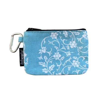Simple purse in light blue with white floral pattern and a carabiner clip.