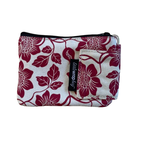 Cream coloured purse with red floral print.
