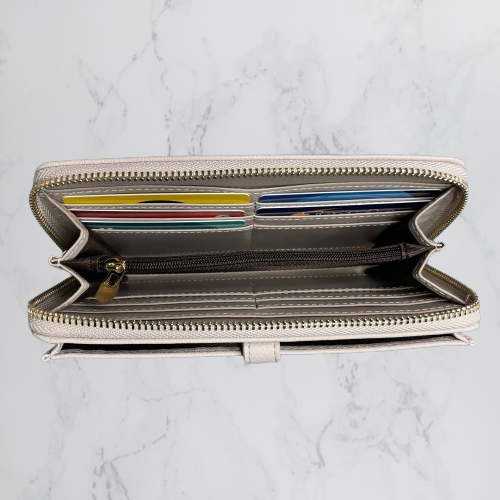 Inside of a light grey wallet by Moana Road.