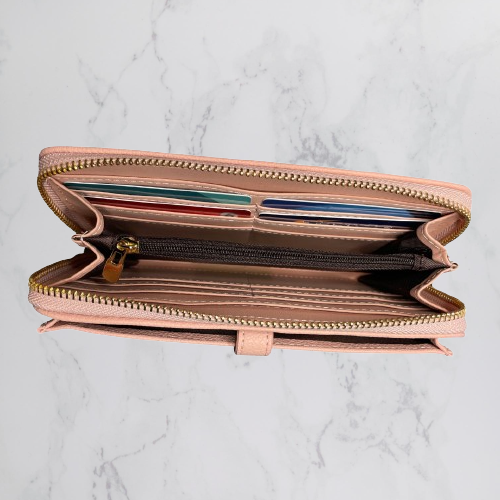 Inside of a pink wallet by Moana Road.