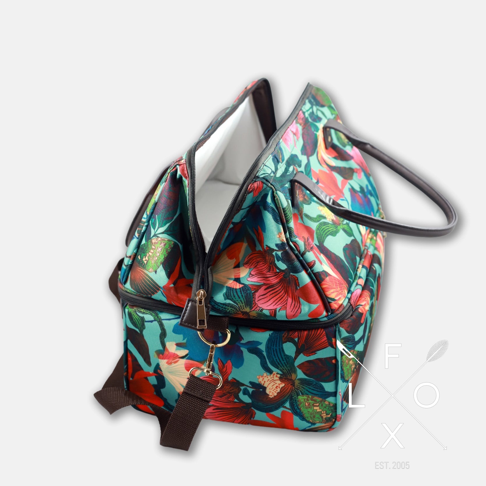 Colourful picnic cooler bag with teal blue background and magnolia flower print.