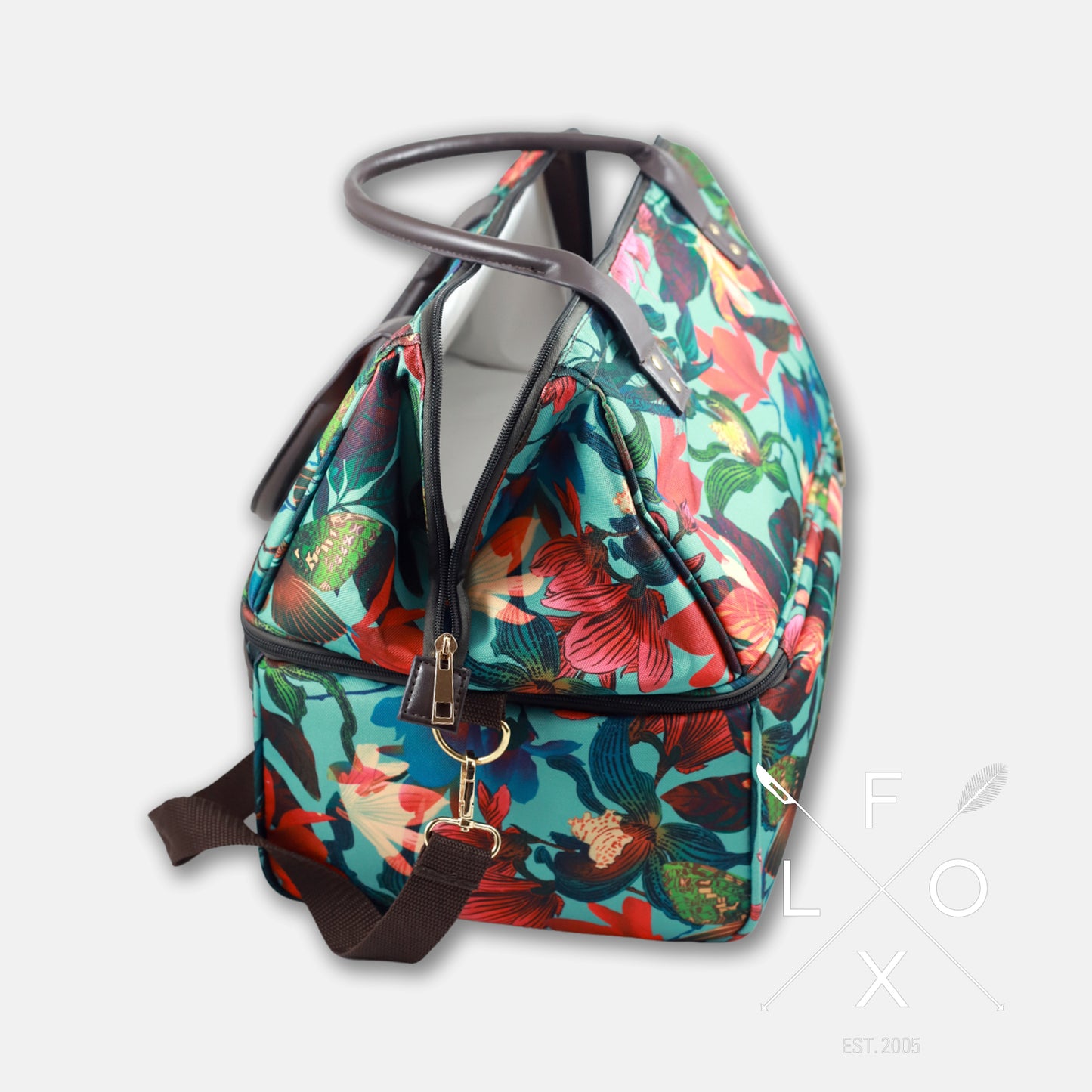 Colourful picnic cooler bag with teal blue background and magnolia flower print.