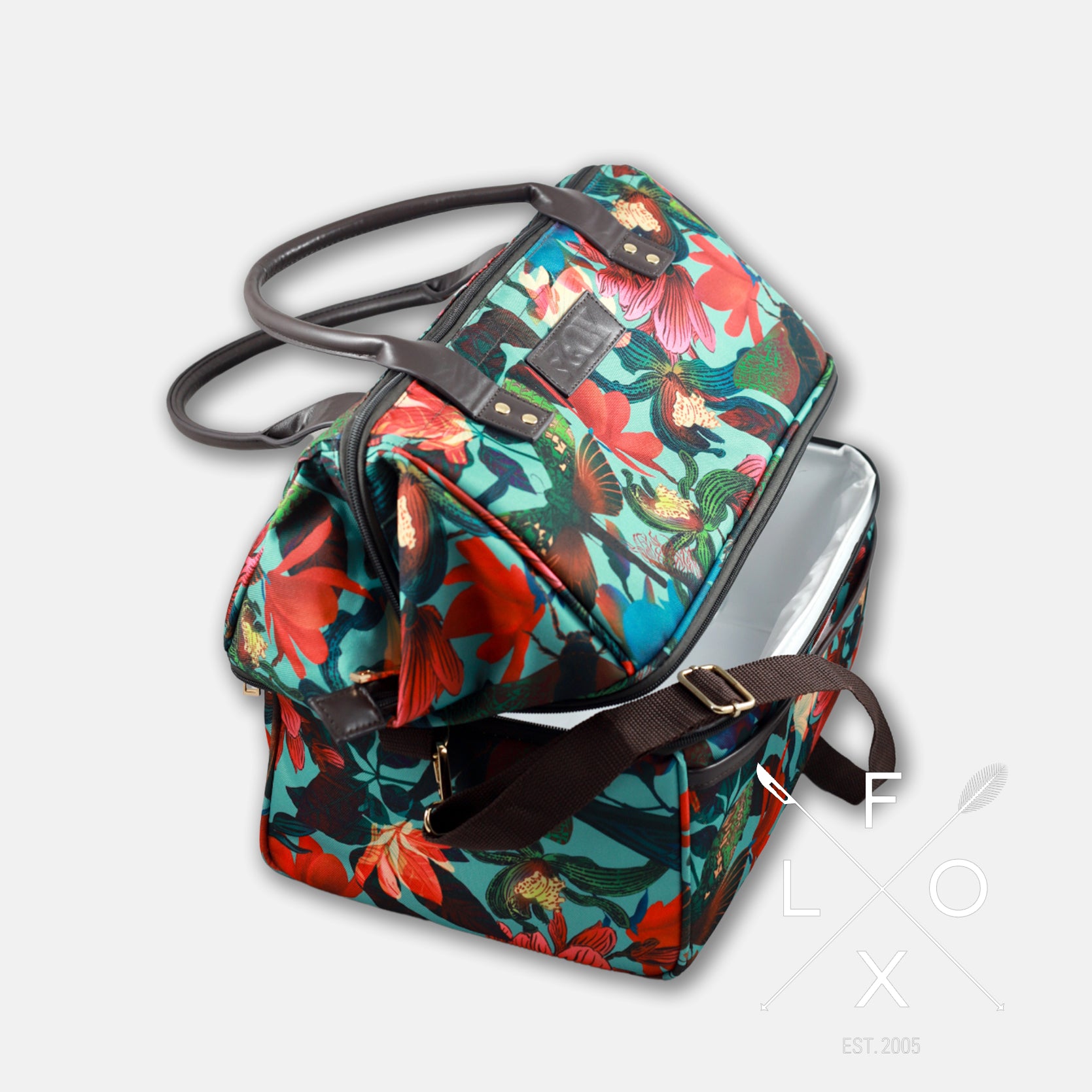 Colourful picnic cooler bag with teal blue background and magnolia flower print.