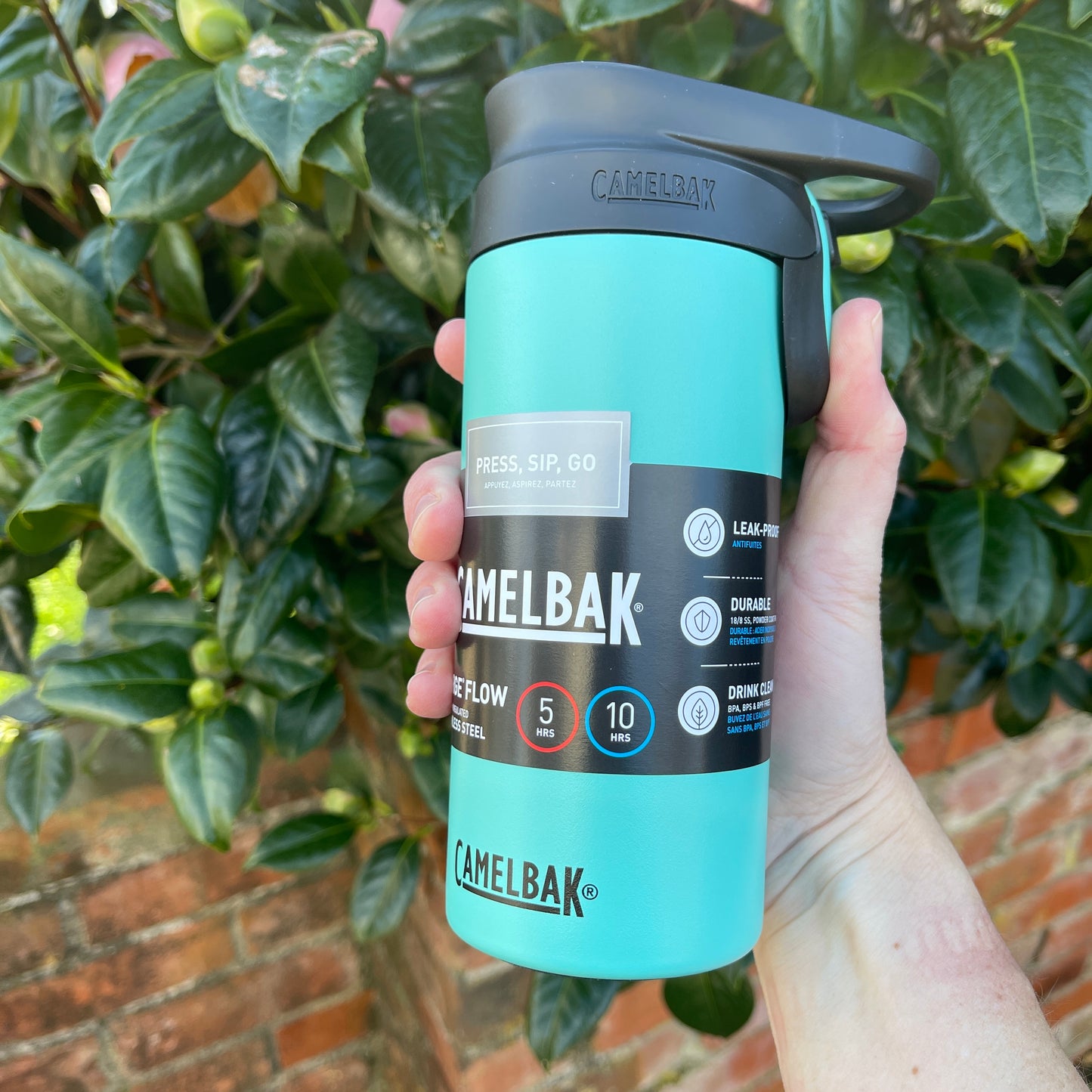 Stainless steel Camelbak insulated coffee cup with a press to sip function in Coastal green colour.