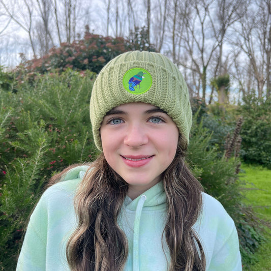 Green knit kids beanie with Tui bird emblem.