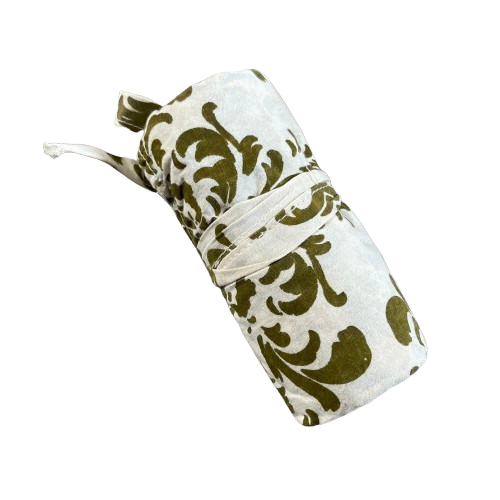 White cotton tote bag with olive green floral decorative pattern rolled up and tied for storage.