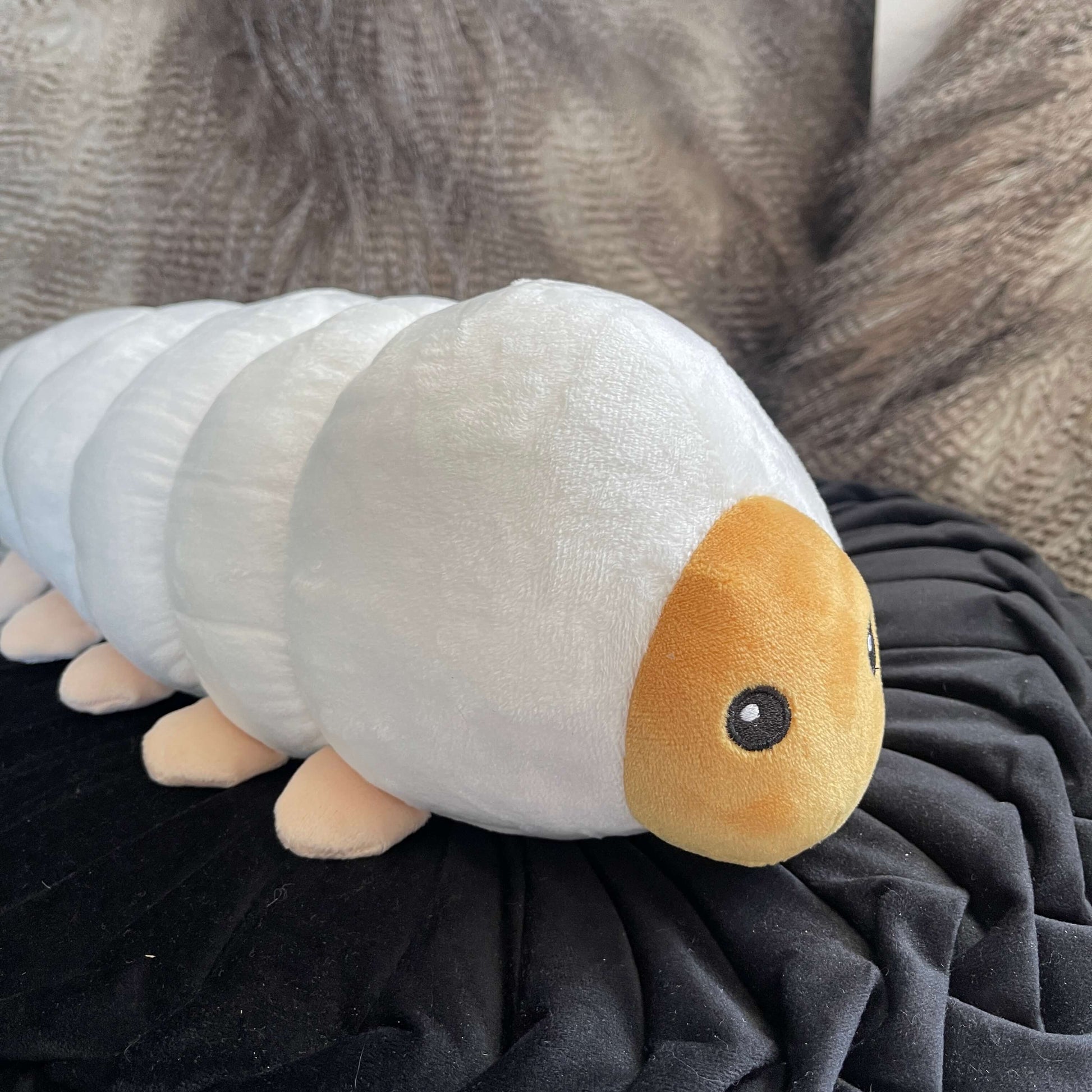 Plush soft toy in the form of a Huhu Grub.