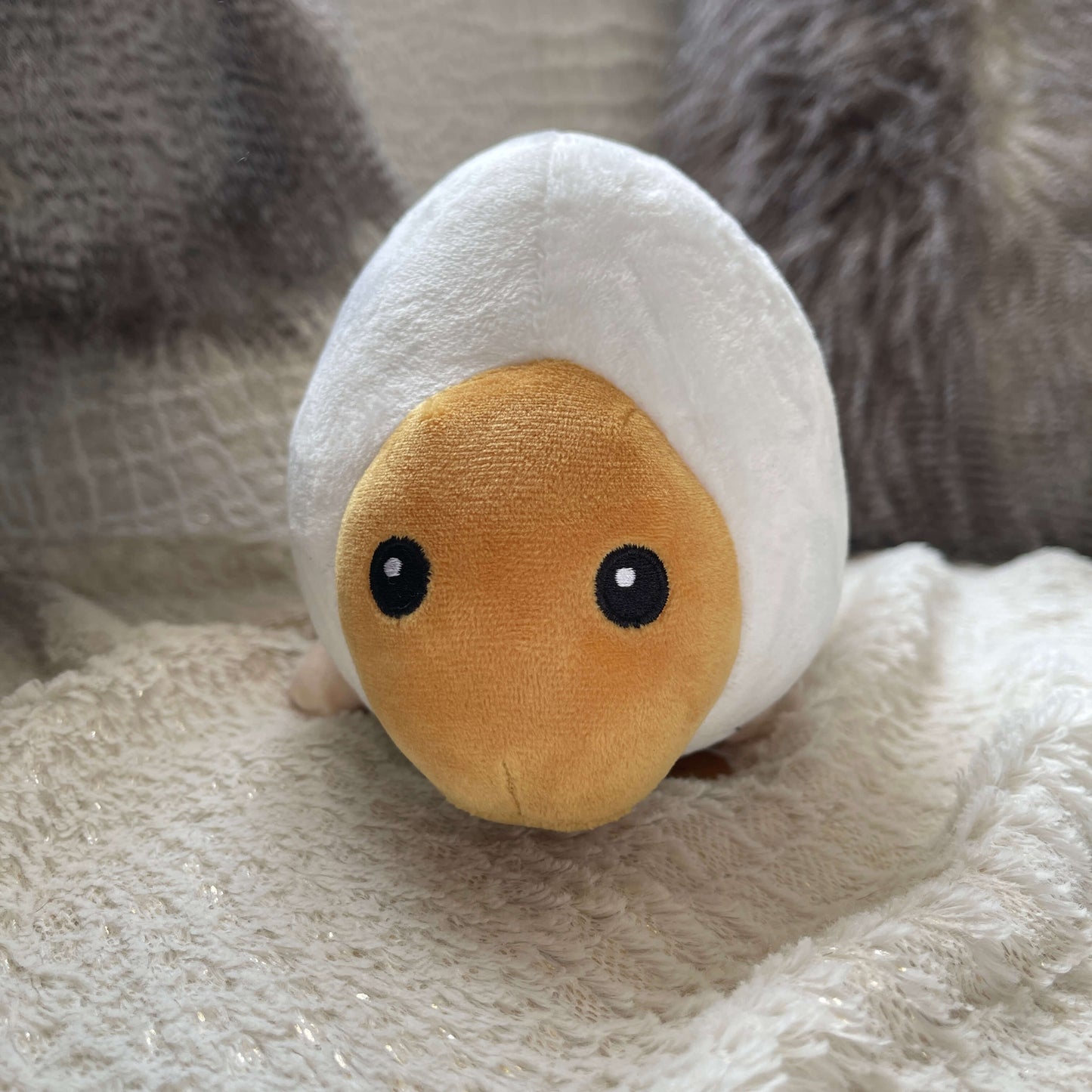 Plush soft toy in the form of a Huhu Grub.