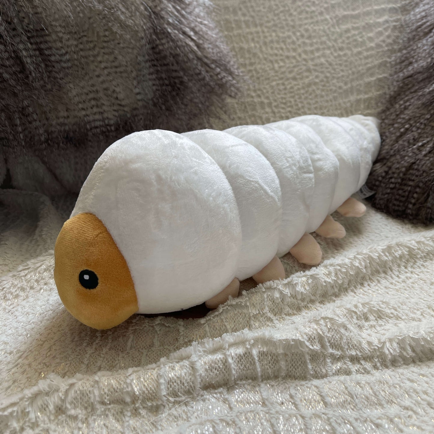 Plush soft toy in the form of a Huhu Grub.