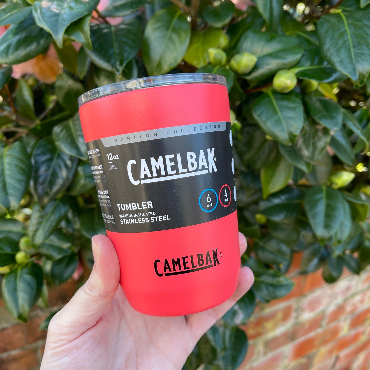 Stainless steel coffee tumbler from Camelbak in a strawberry red colour.