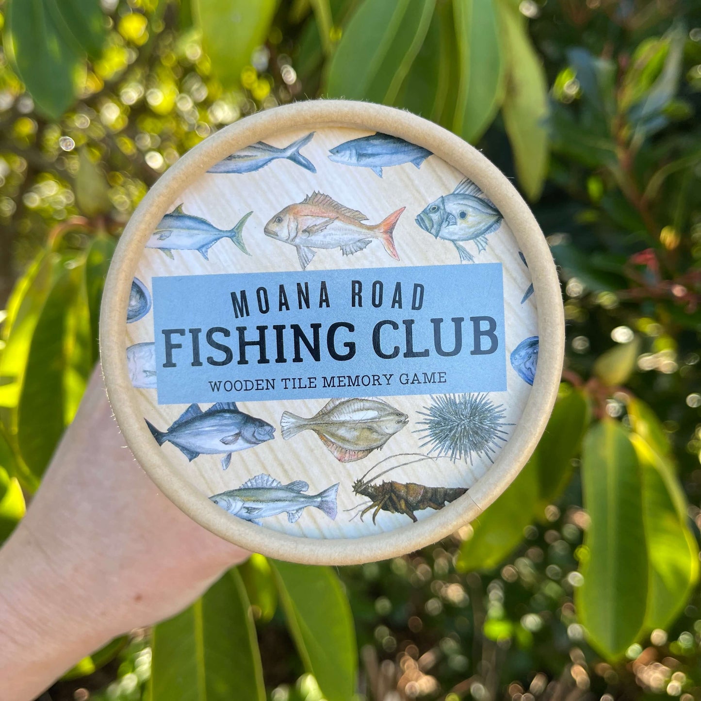 Moana Road Fishing Club memory game storage tube lid.