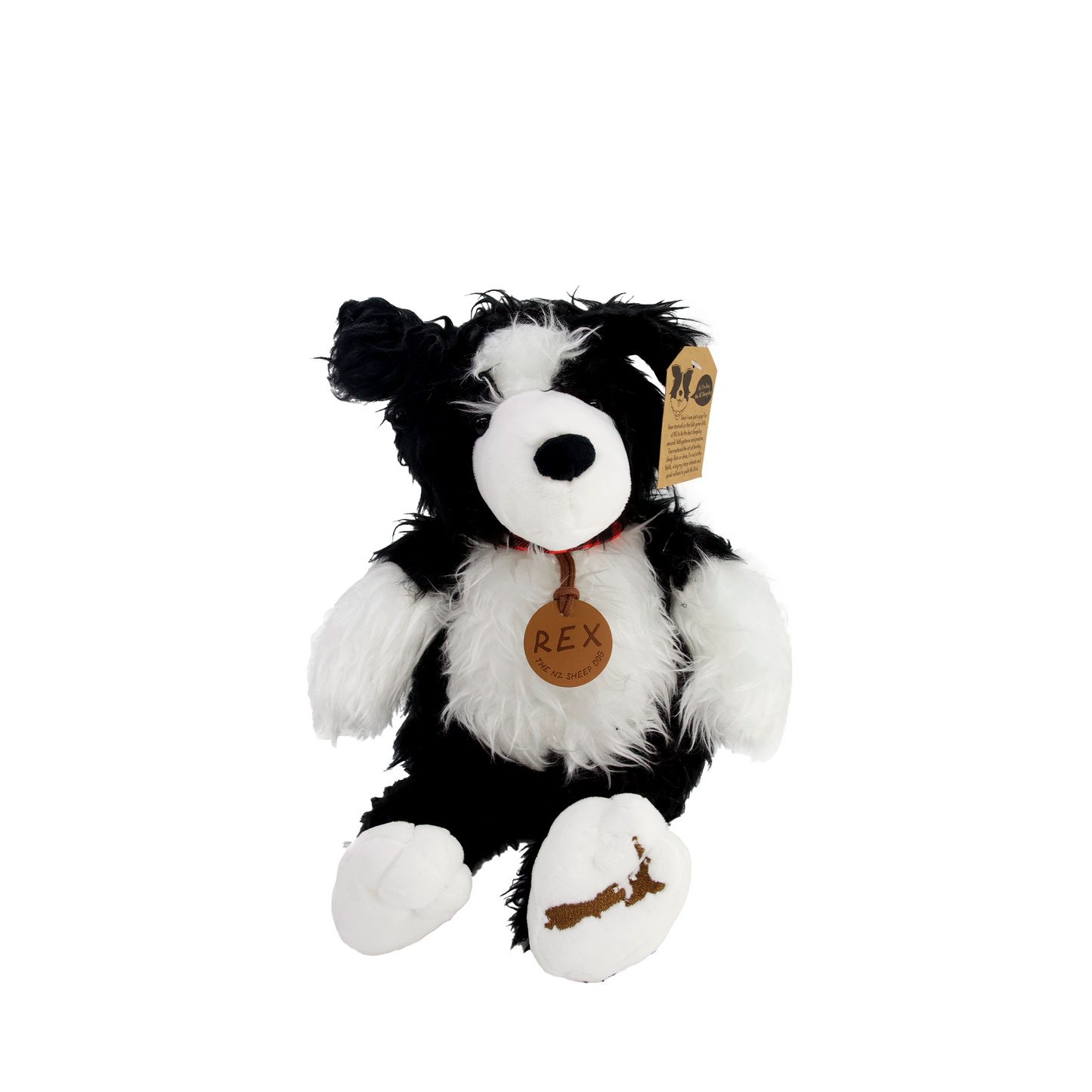 A black & white sheepdog soft toy. The toy dog has a brown leather name tag with REX on it. It also has a map of New Zealand on his right paw.