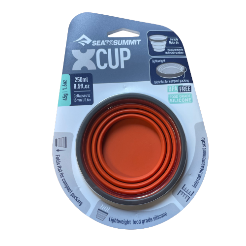 Rust orange silicone collapsible X cup by Sea to Summit.