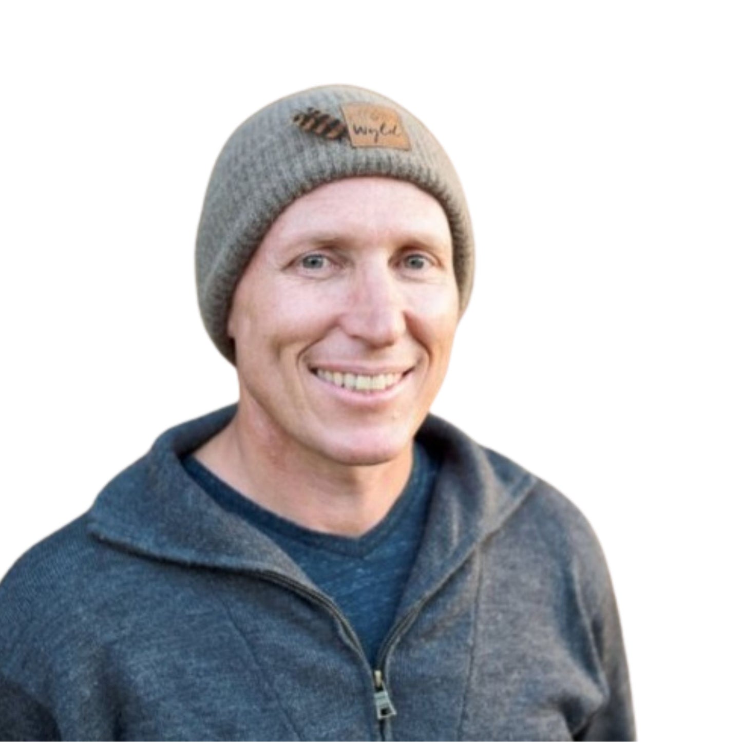 Portrait of a man wearing a Wyld Weka knit beanie with a Weka feather.