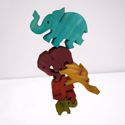 Wooden coloured balancing elephants.