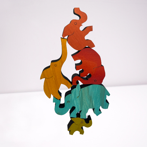 Wooden coloured balancing elephants.