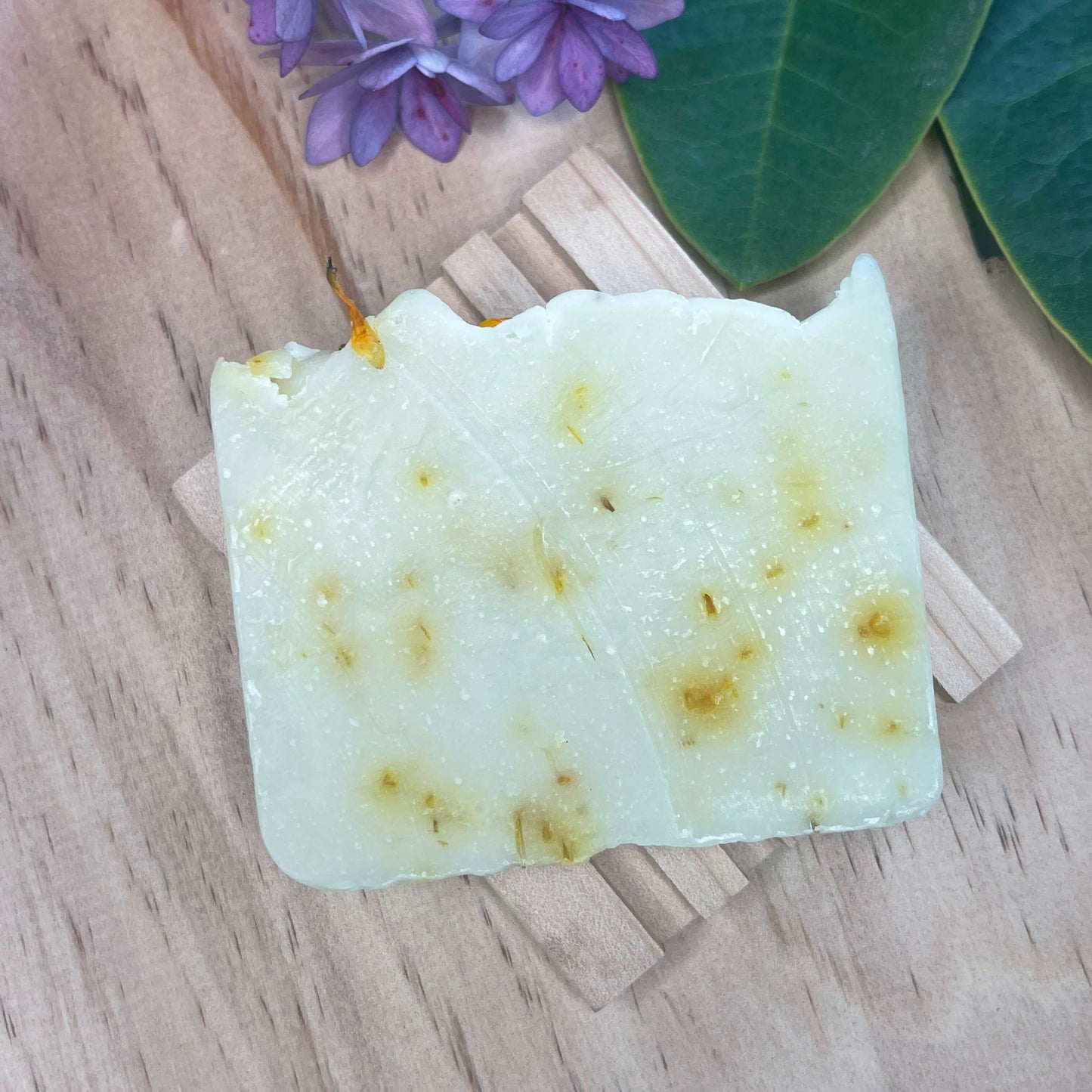 Natural soap on a wooden soap rack.