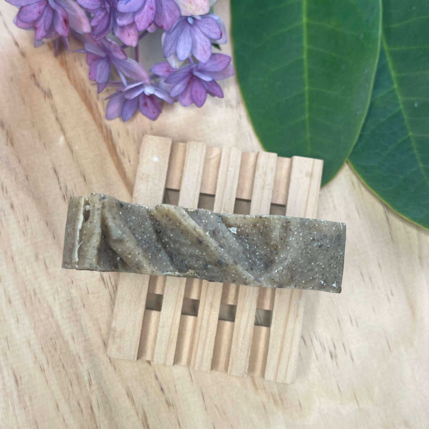 Natural soap on a wooden soap rack.