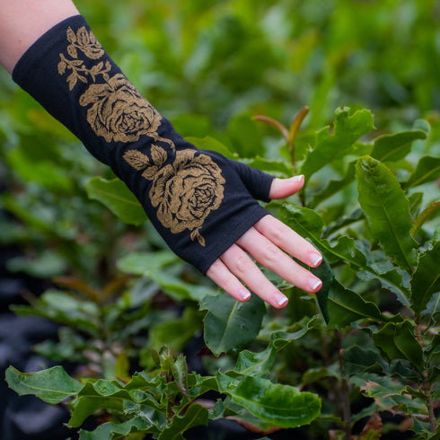 Fingerless merino gloves in black with gold roses.