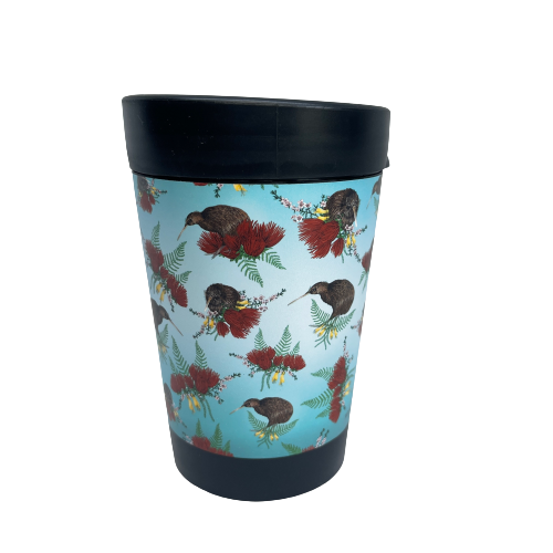 Black reusable coffee cup with blue ombre wrap featuring Kiwi birds and bunches of Pohutukawa flowers, Kowhai flowers and Ferns.