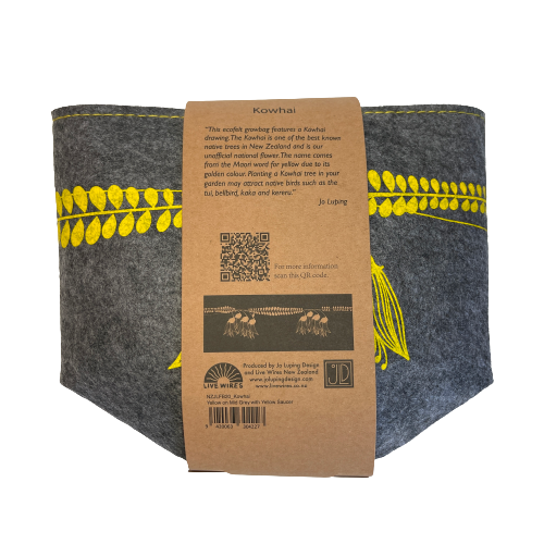 Grey felt planter with yellow kowhai flowers printed on it and sitting in a yellow dish, flat packed and wrapped with kraft paper.