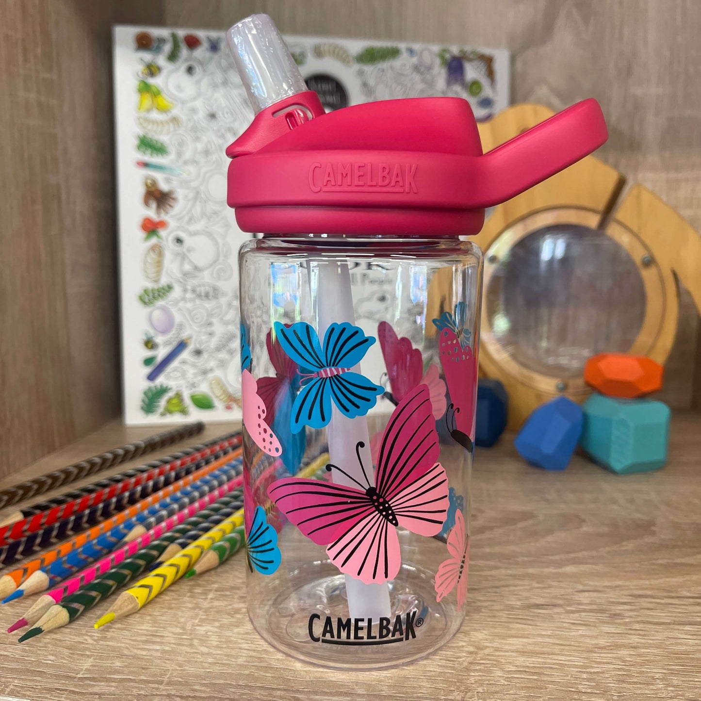 Pink and blue butterfly print drink bottle by camelbak.