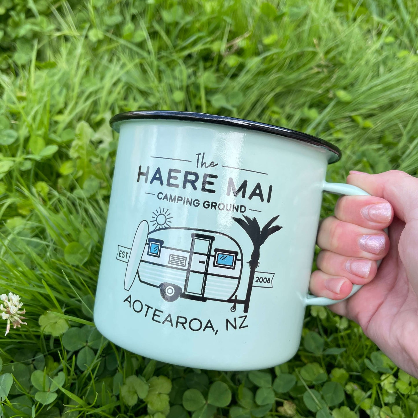 Large enamel mug with retro New Zealand camping scene.