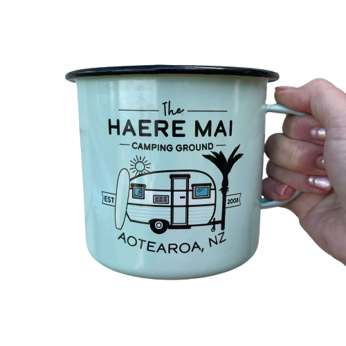 Large enamel mug with retro New Zealand camping scene.
