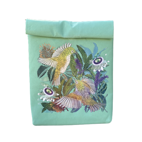 A light blue folding paper style lunch bag with floral and bird design.