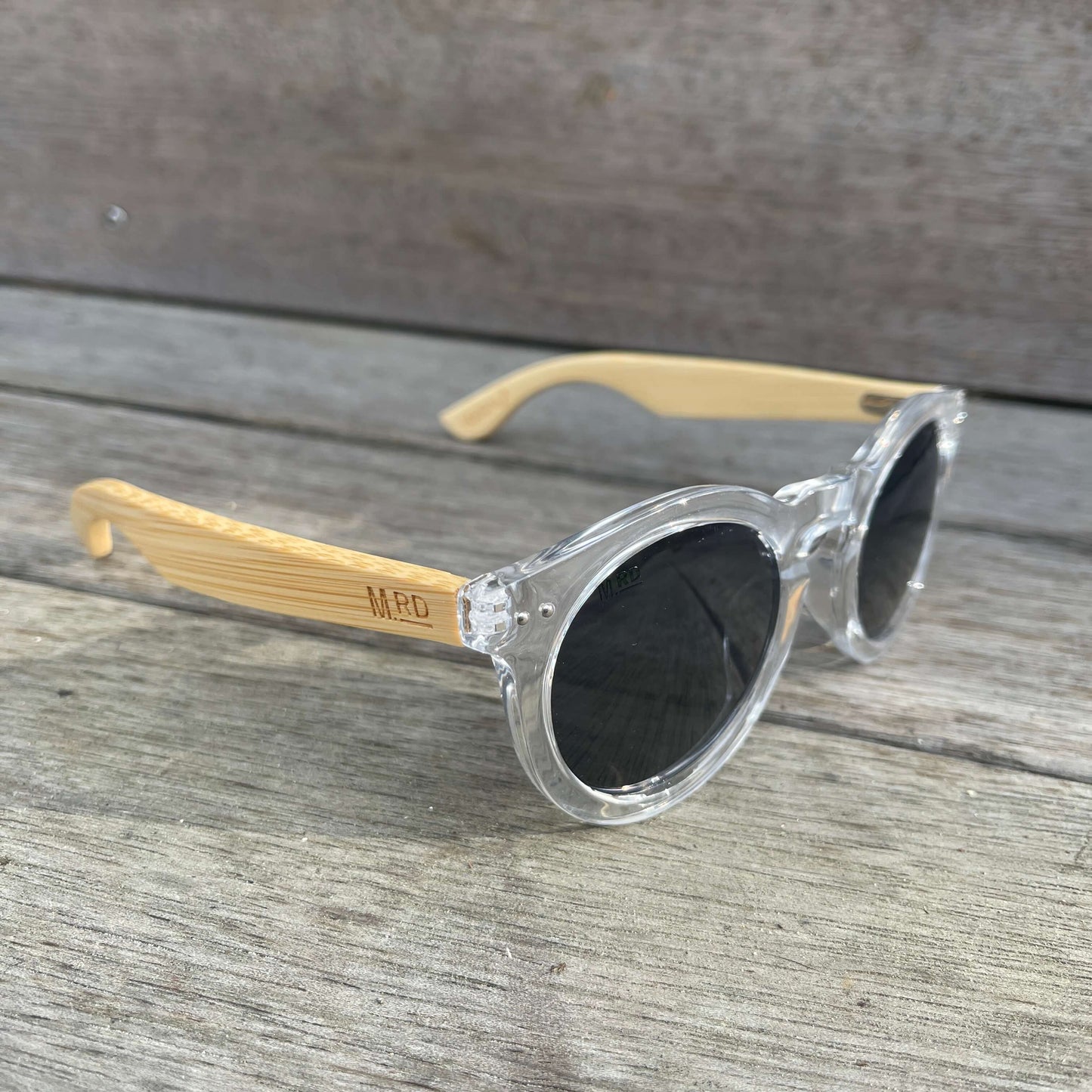 Womens sunglasses with clear frames and bamboo arms in a Grace Kelly style.
