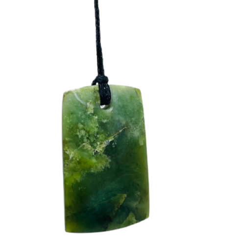 Greenstone freeform pendant on a black wax cord.