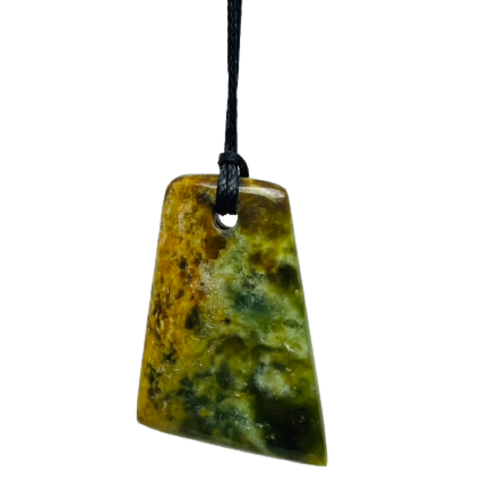 Greenstone freeform pendant on a black wax cord.