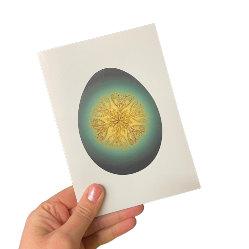 Greeting card with greenstone themed egg and gold vine pattern inside egg.
