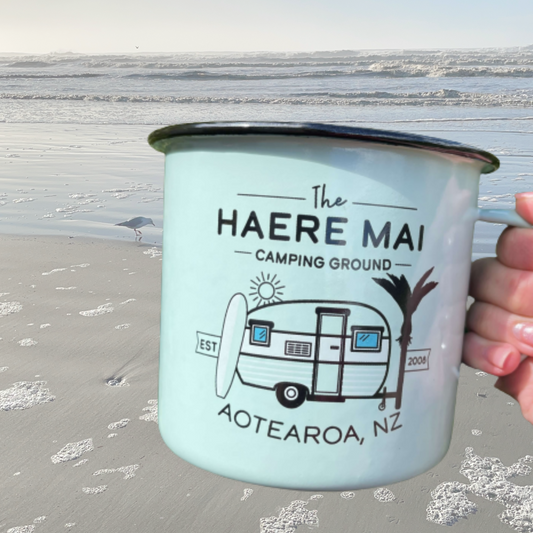 Large enamel mug with retro New Zealand camping scene.