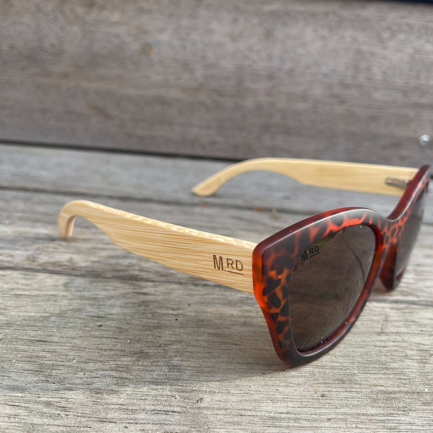 Womens sunglasses with tortoiseshell frame and bamboo arms.