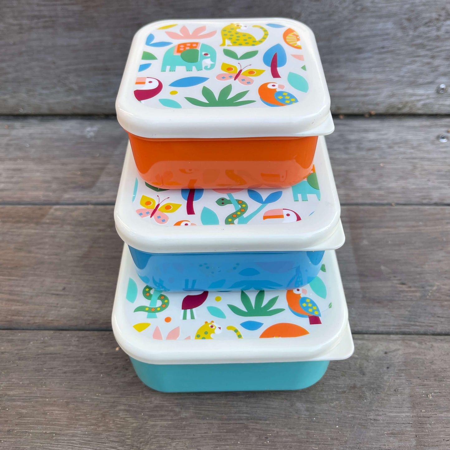 Trio of snack boxes featuring jungle animals on the lids.