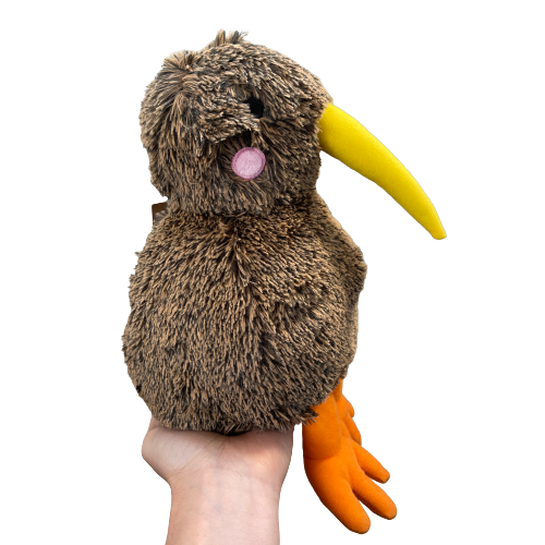 Soft toy Kiwi bird in brown with yellow beak and orange feet.