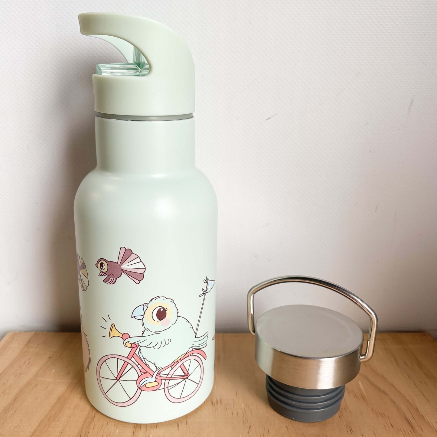 Kuwi and friends character drink bottle with sipper top and spare stainless sports top.
