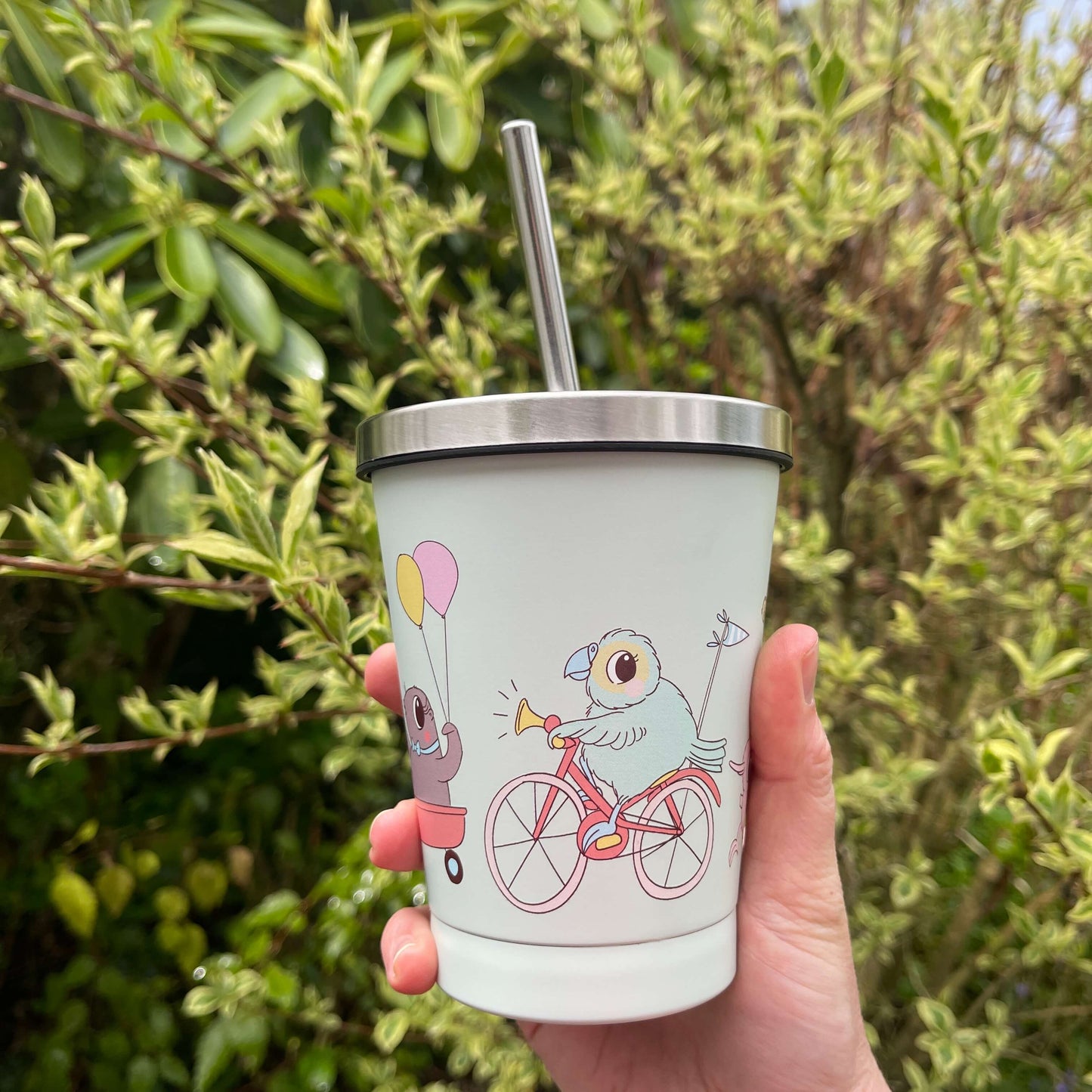 Kuwi and friends character smoothie cup with stainless lid and straw.