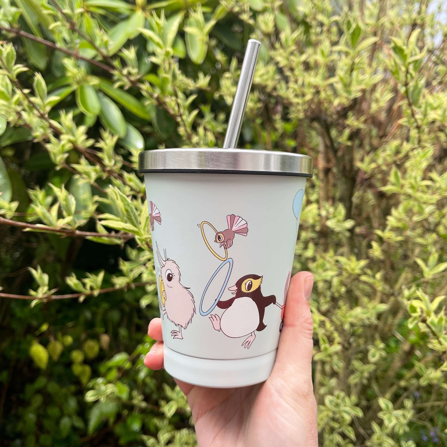 Kuwi and friends character smoothie cup with stainless lid and straw.