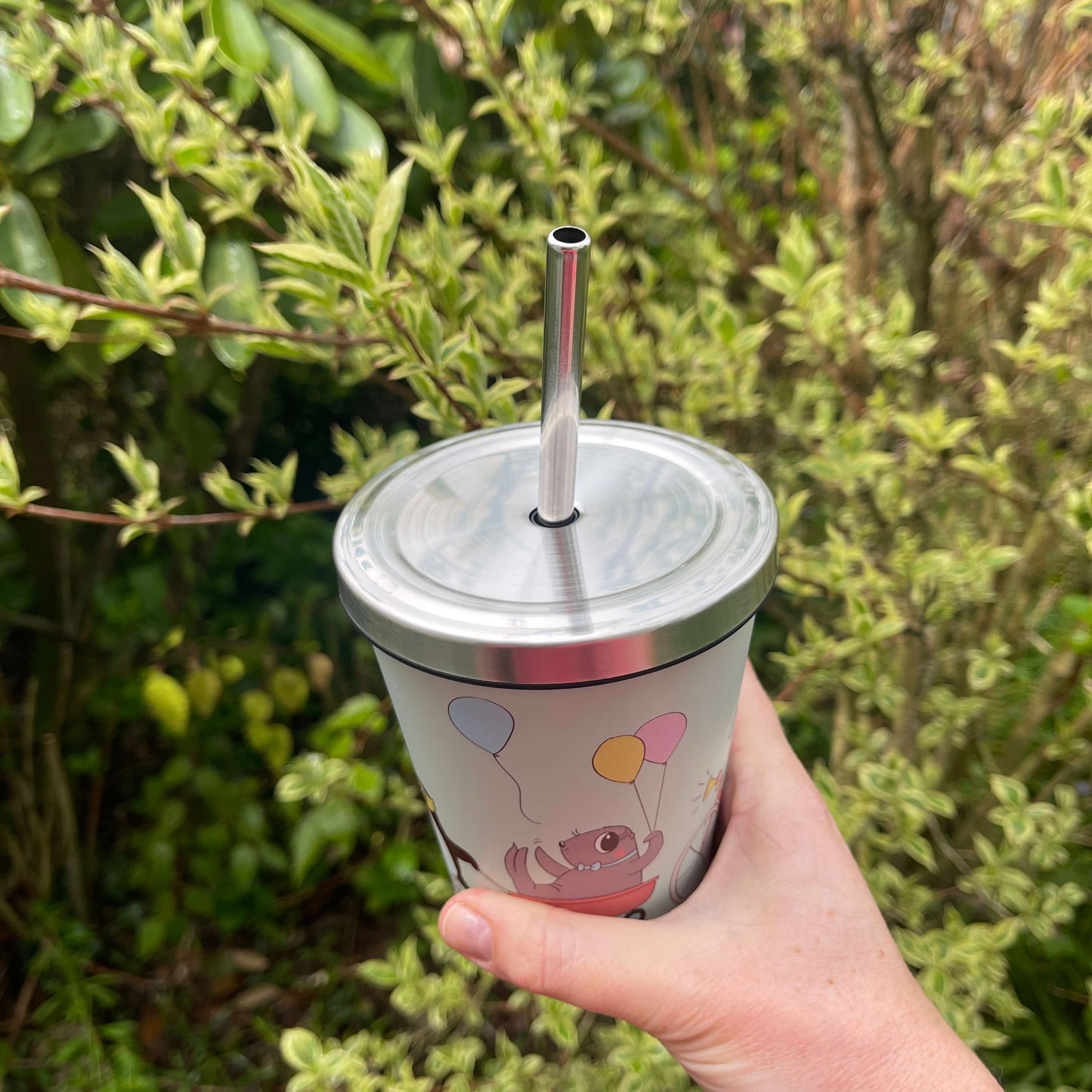 Kuwi and friends character smoothie cup with stainless lid and straw.