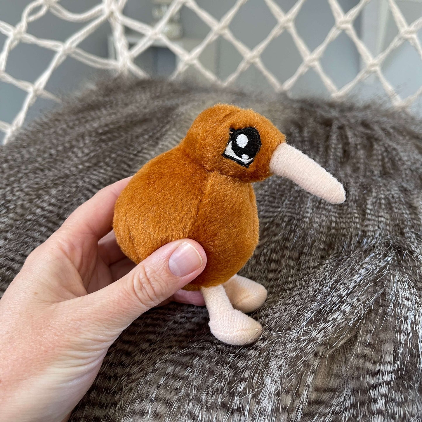 Mini kiwi plush toy in light brown with beige beak and feet.
