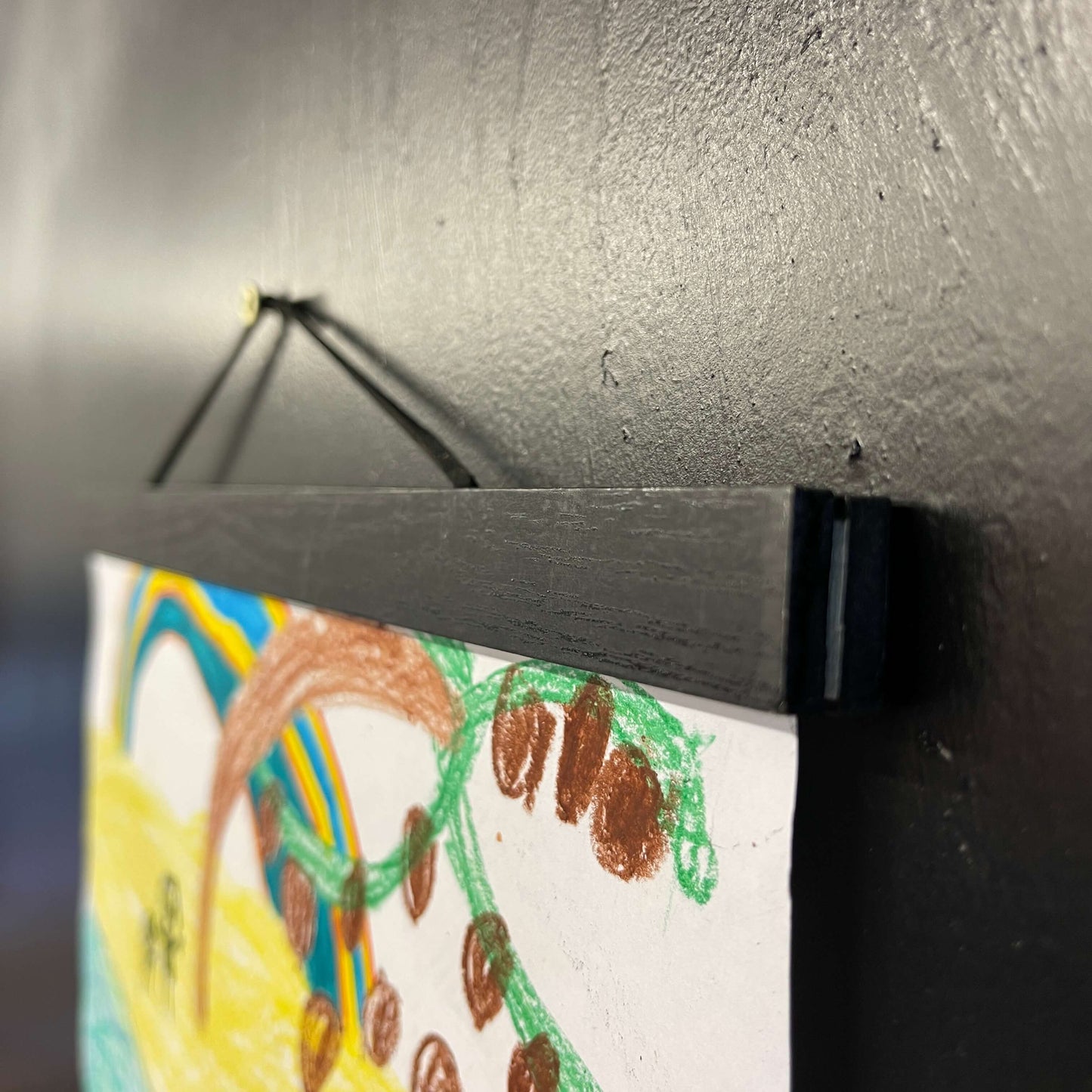 Wooden magnet picture frame in black.