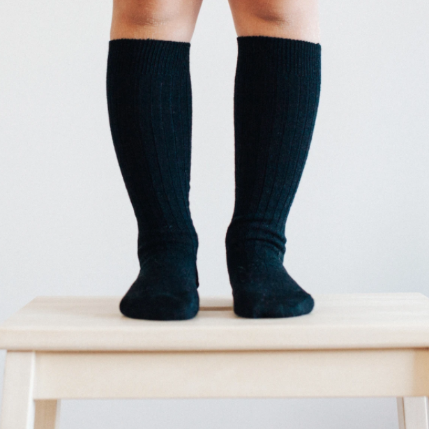 Knee high black merino socks.