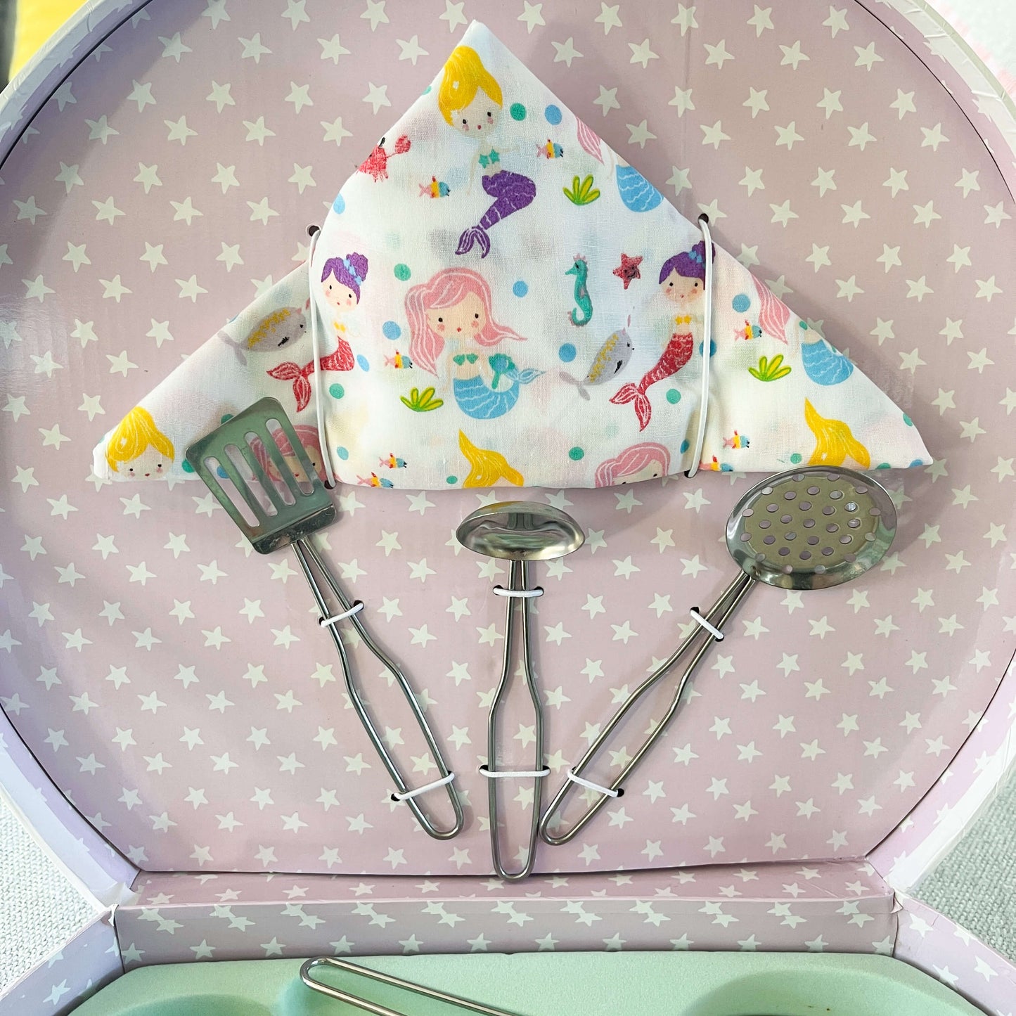 Childrens mermaid themed kitchen set utensils and cloth.