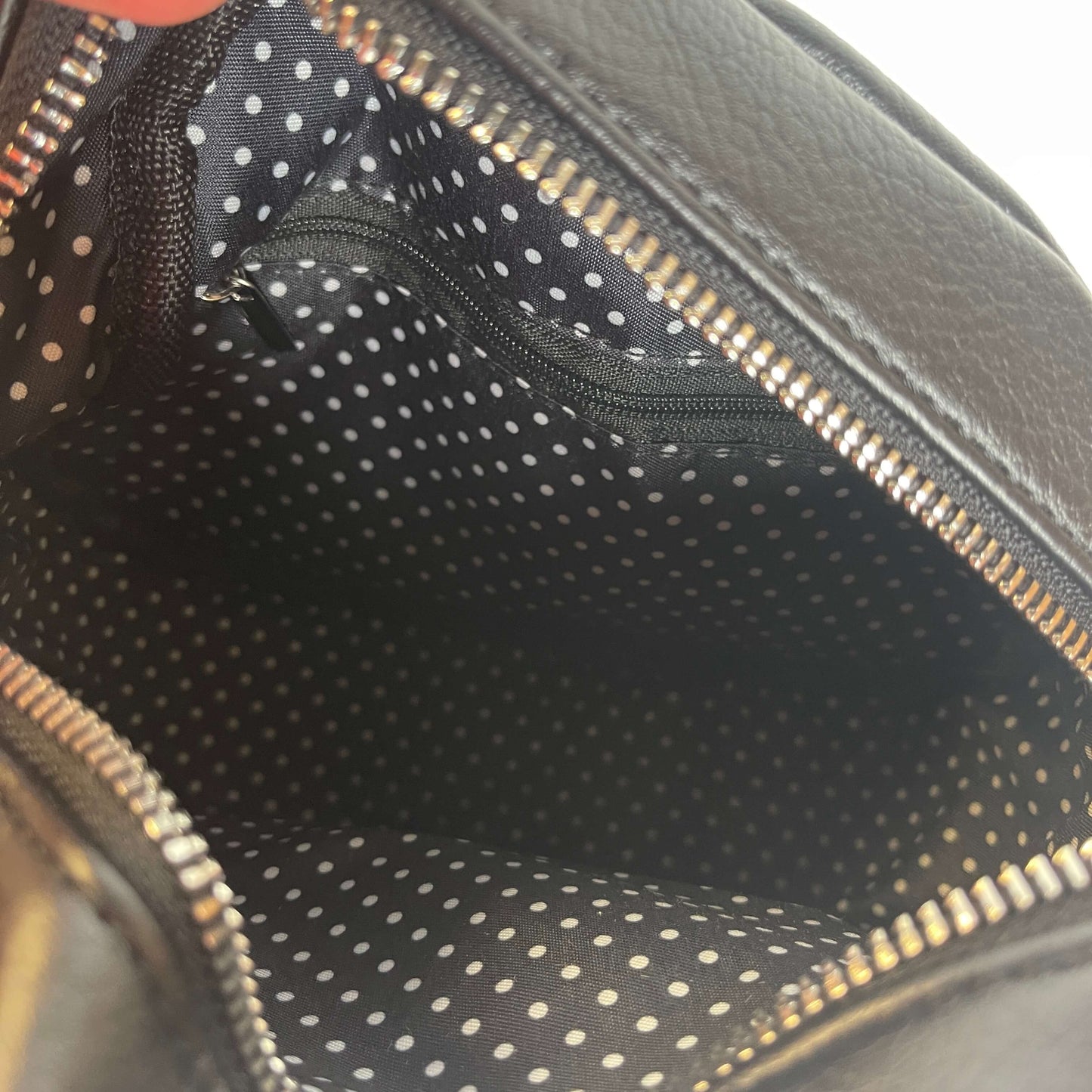 Lining from a Black circular handbag by Moana Rd.