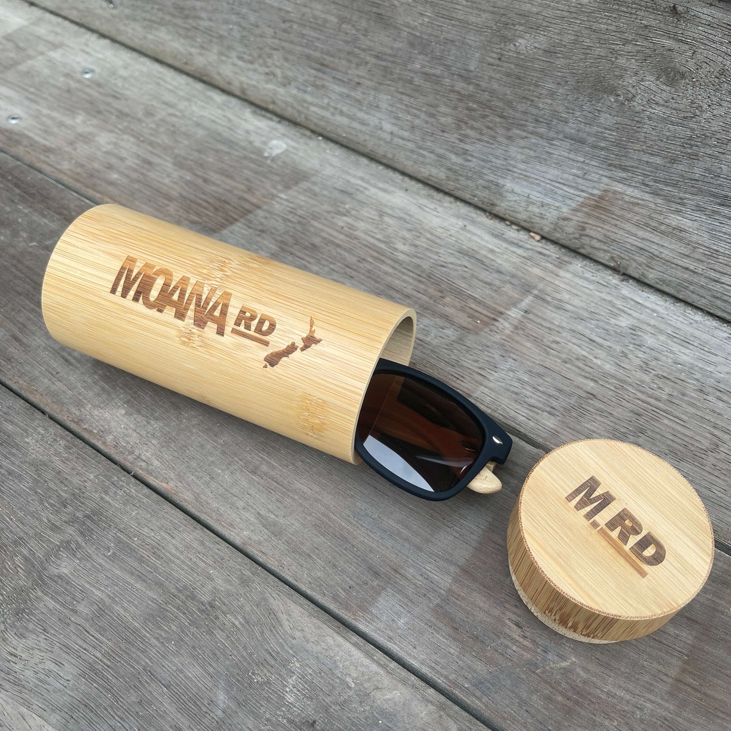 Round wooden sunglasses case.